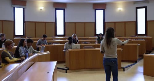 Teacher Working with Students Inside Classroom at School University Academic