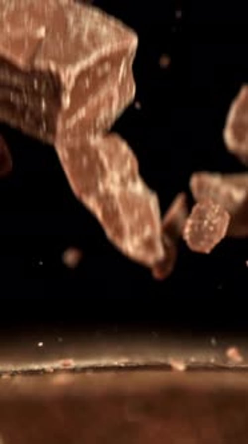 Super Slow Motion Pieces of Dark Milk Chocolate Filmed on a Highspeed Camera at 1000 Fps