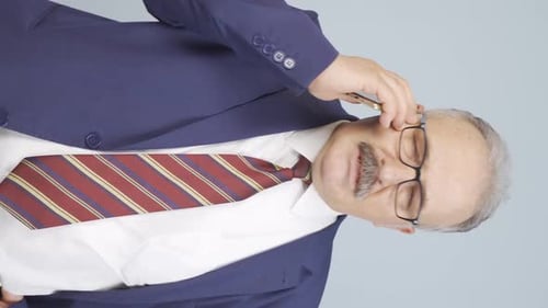 Man in Suit Talking on Smartphone Portrait