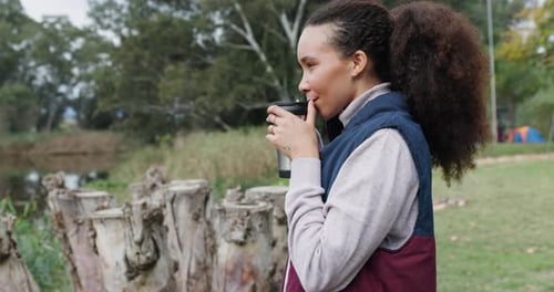 Woman Drinking Coffee Outdoors in Nature