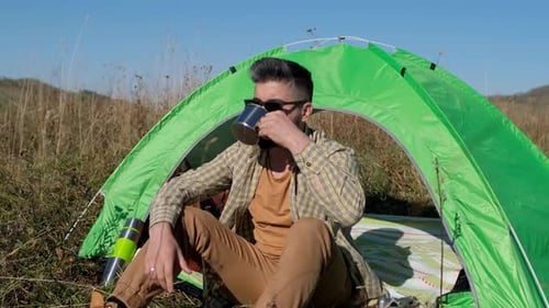 Hiker Tourist Traveler Man Drinking Hot Thermos Cup Mountain Camping Camp Tent Traveling Hikingю