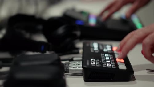 Close-up of Hand Operating Professional Video Switcher Console
