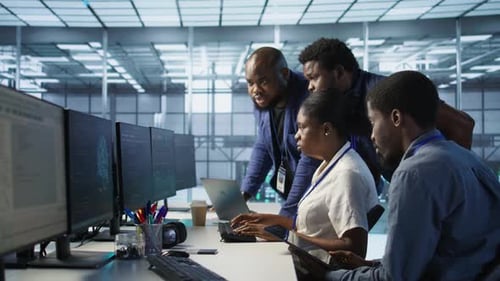 Team of Data Center Technicians Maintaining Company Network Infrastructure