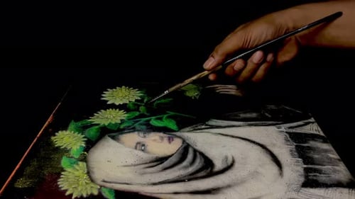 Artist Hand Painting Woman Portrait on Black Canvas
