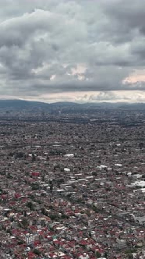 Vertical aerial hyperlapse showing urban sprawl in Ecatepec, Mexico City