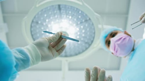 Doctors in Operating Room Preparing for Surgery