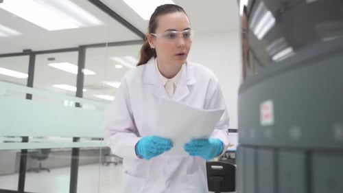 Scientist Working with Analyzer in Modern Laboratory