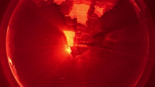 Rotating Digital Earth Globe with Glowing Red Technology Grid