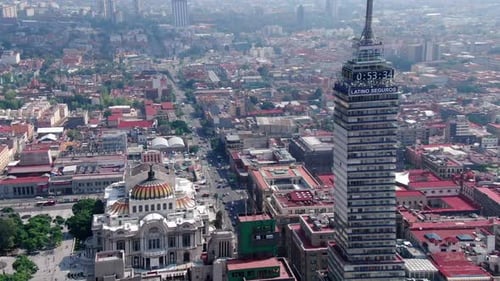 Aerial shot of a skyscraper and the the Palace of fine Arts in Mexico City