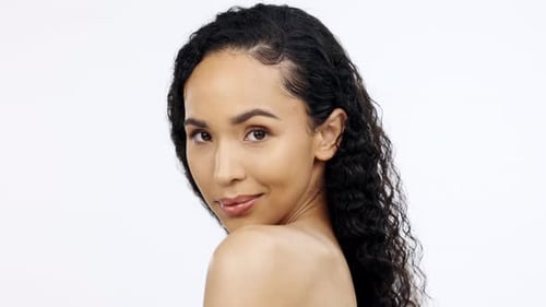 Woman Winks and Smiles in Studio Close Up