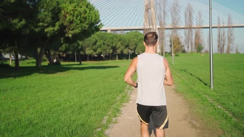 Male Jogger Running in Park