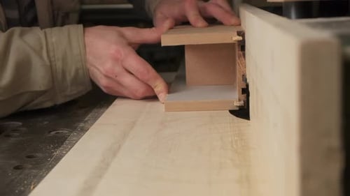 Hands Crafting Wood With Woodworking Machine