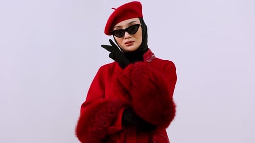 Fashionable Woman in Red Coat and Beret Posing