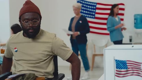 Man in Wheelchair Voting at Polling Station
