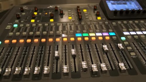 Working on a large sound mixer