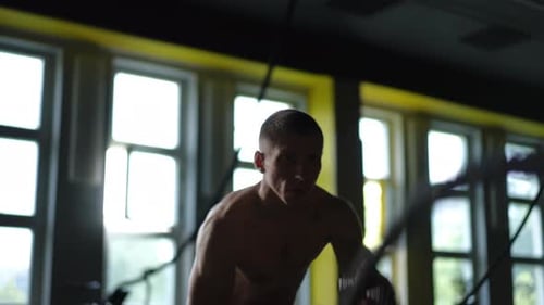 Engaging in an Intense Workout Session at the Gym to Achieve Optimal Fitness Results