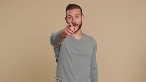 Lebanese Man Pointing to Camera and Happy Expression Making Choice Showing Direction Find Winner