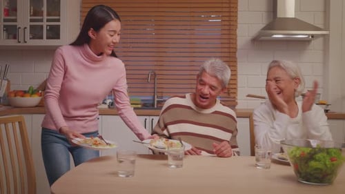 Smiling Family Sharing Meal in Home Kitchen