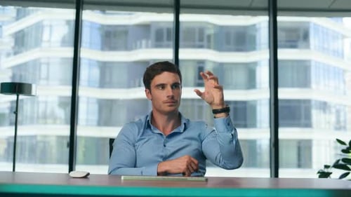 Manager Working with Holographic Projection in Modern Futuristic Office Close Up. Worried