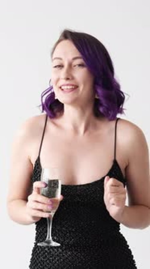 Young Woman Celebrates with Sparkling Wine