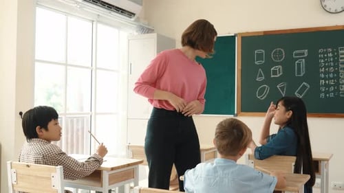Skilled student raised hand and asking teacher about math question. Pedagogy.