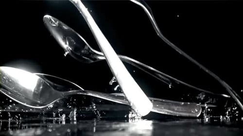 Forks and Spoons Falling in Dramatic Slow Motion