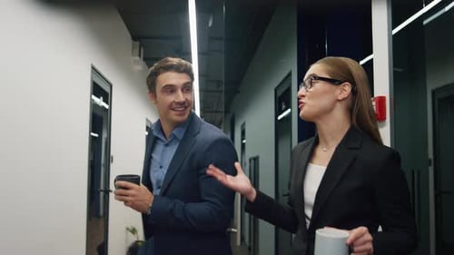 Friendly Colleagues Walking Office in Morning