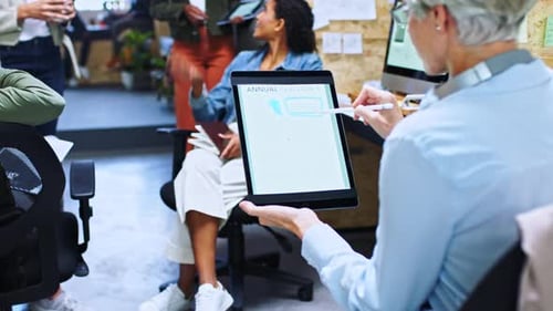 Diverse Team Collaborates on Statistics with Tablets