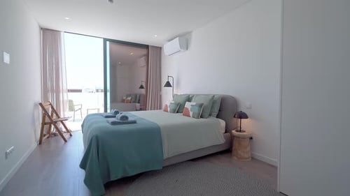 Natural Light Illuminates a Modern Hotel Room Featuring a Comfortable Bed Stylish Decor and Access