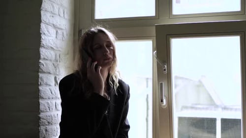 Girl Using Smart Phone. Young Woman with Phone