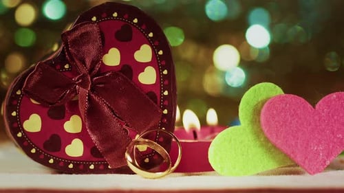 Valentines Day Concept Wedding Rings In Candle Light And Colorful Bokeh
