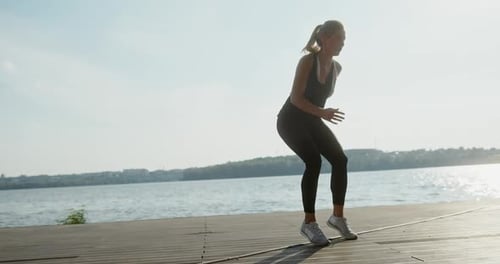 Sportswoman Exercising on Step on Pier