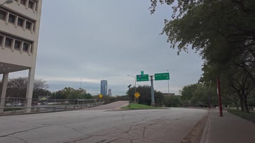 Walking a Houston street with road signs at I45 exit