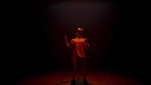 Man uses VR headset in dark studio setting