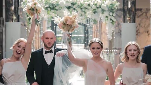 Joyful Wedding Party Celebrating A Newlywed Couple and Their Friends Celebrate Postceremony with the