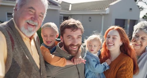 Happy Multigenerational Family Gathered Outside Home