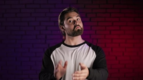 Handsome Guy Standing in Studio and Applauding Happily