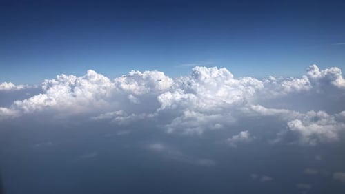 Aerial View of Vast White Clouds and Blue Sky