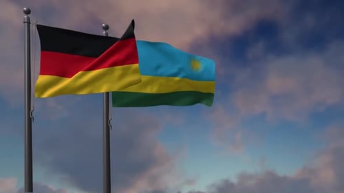 German and Rwandan Flags Waving in the Wind
