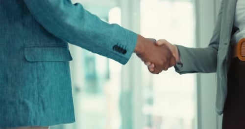 Professionals Shaking Hands in Modern Office