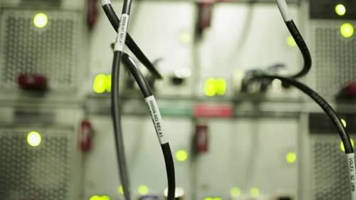 Server Stack with Connecting Cables and Green Lights
