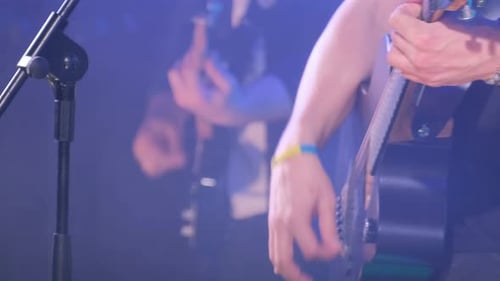 Musicians Play Acoustic Guitars During a Concert on a Big Stage Pop Jazz Rock Folk Country