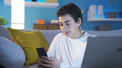 Teen Using Smartphone on Couch at Home
