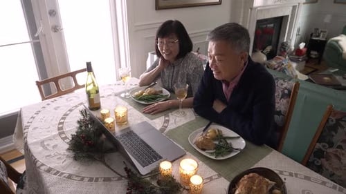 Senior Couple Video Call During Meal at Home