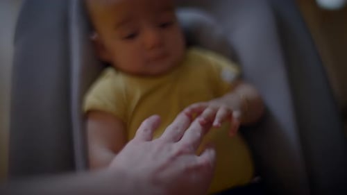Infant Holding Hand