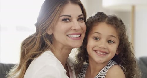 Happy Mother and Daughter Smiling Together Indoors