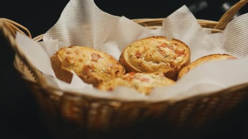 Bacon and Cheese Rolls in a Wicker Basket Close Up