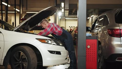 Vehicle Service Manager Male Work in Mechanics Workshop for Maintenance and