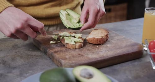 Preparing Avocado Toast on a Cutting Board