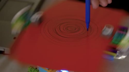 Pen Draws Spiral on Spinning Paper